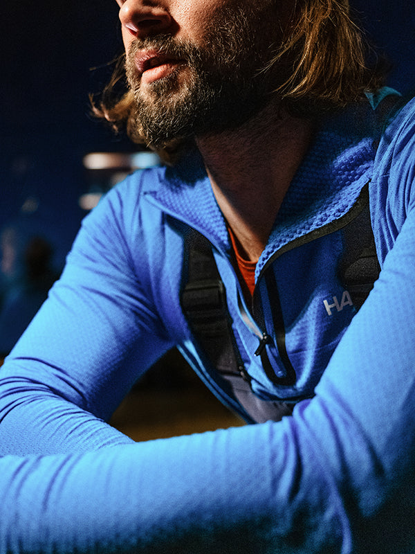 Man wearing Halti blue shirt as part of ski layering outfit