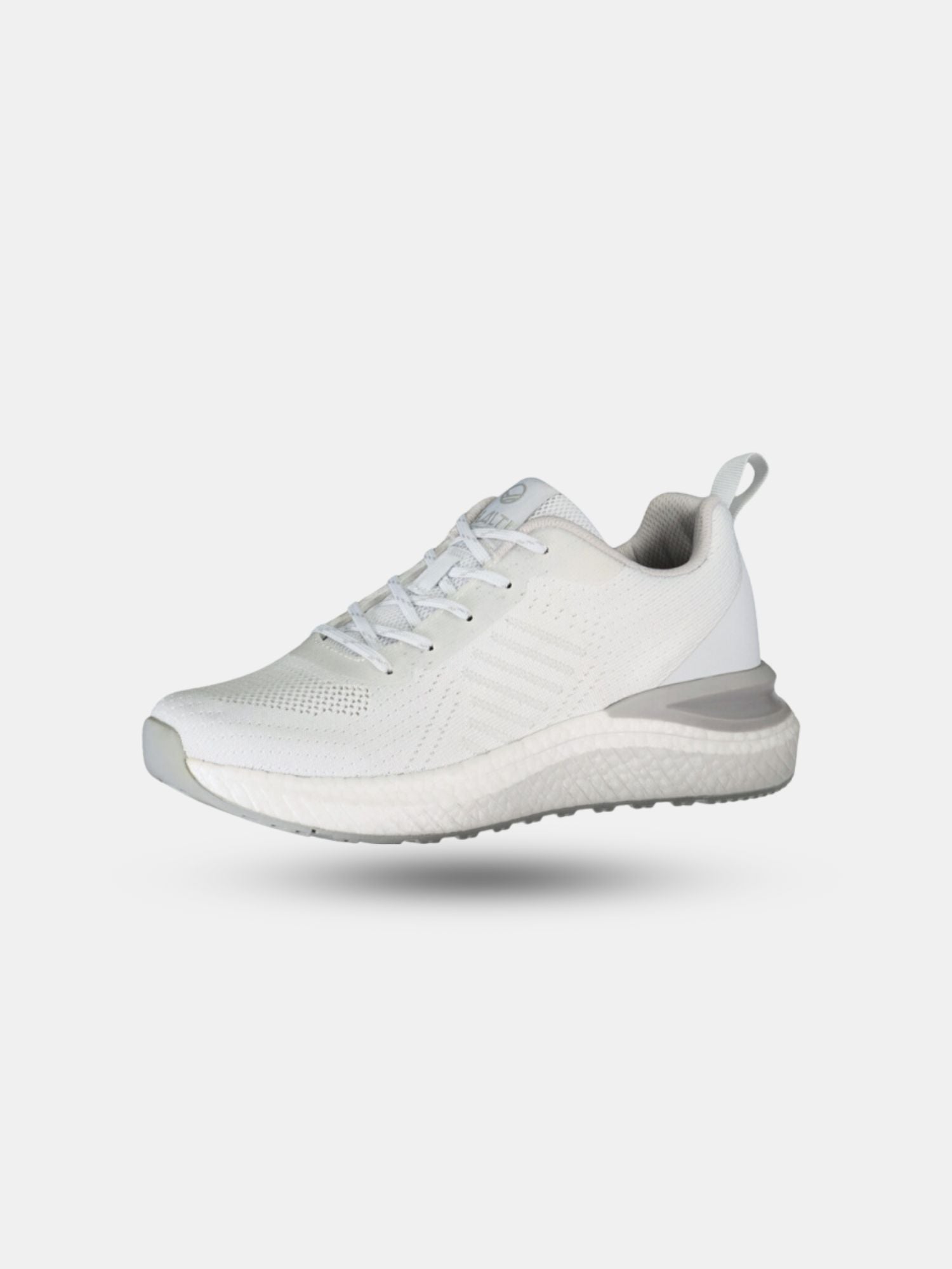 The Halti Gale Sneaker Mens, featuring a white knit upper and textured sole, is shown on a plain light background.
