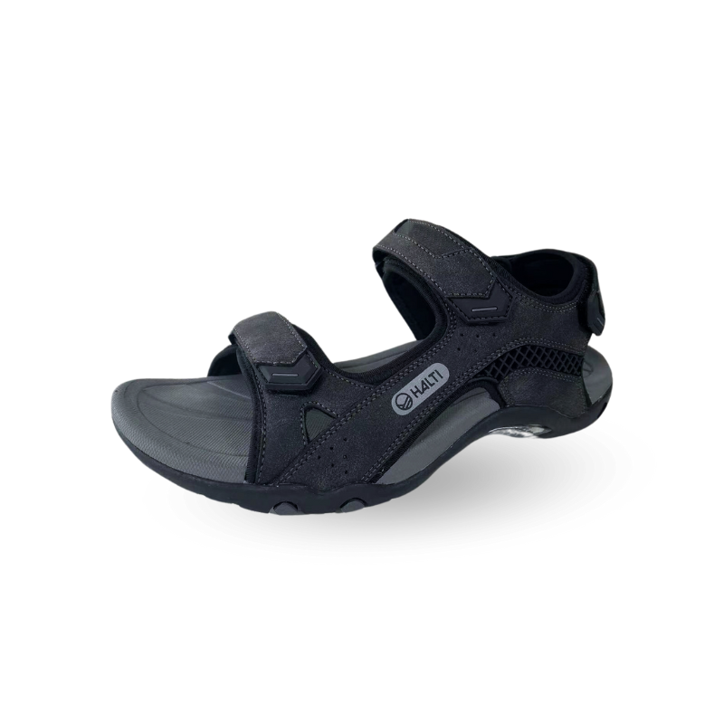 The Halti Route Outdoor Sandal is black with adjustable Velcro straps and a gray sole, shown on a white background.