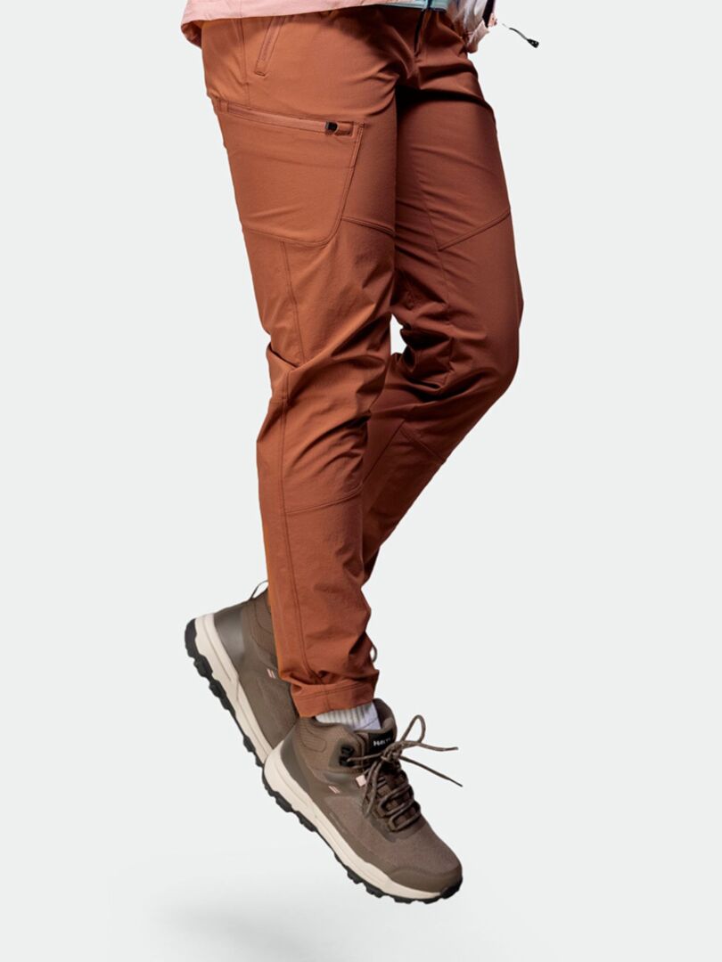 Person wearing rust-colored pants and Halti Fara 3 DX Mid Outdoor Shoe Womens against a plain gray background.