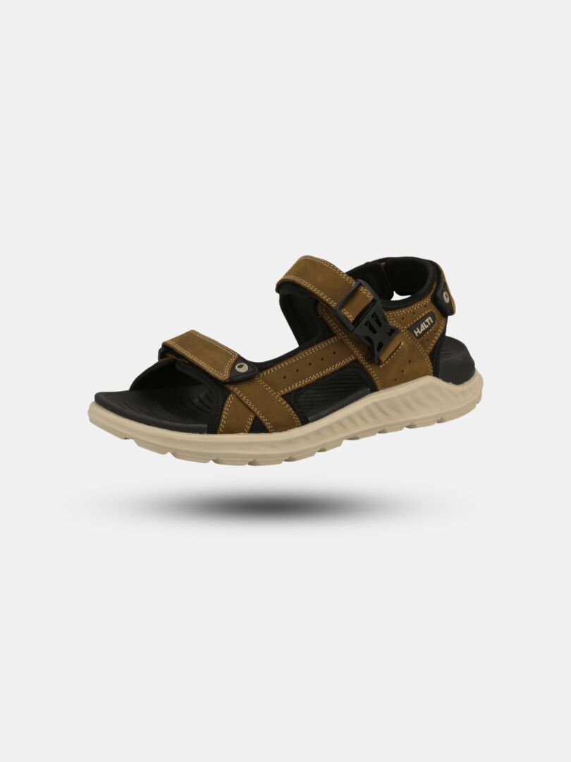 Halti Sora Sandal in brown and black nubuck with adjustable straps, ergonomic footbed, on light gray background.