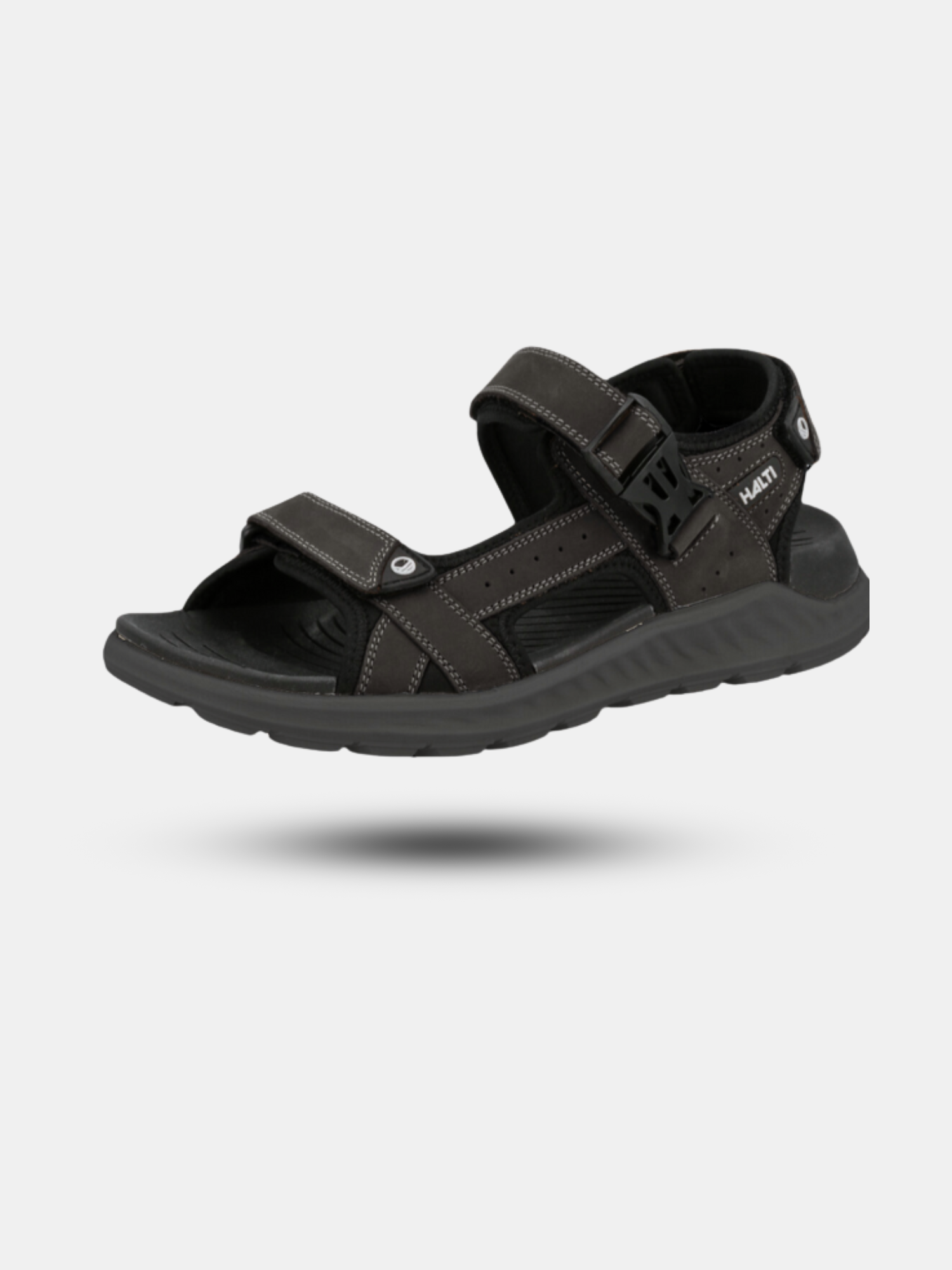 The Halti Sora Sandal is black nubuck leather with ergonomic footbed and adjustable straps on light gray background.