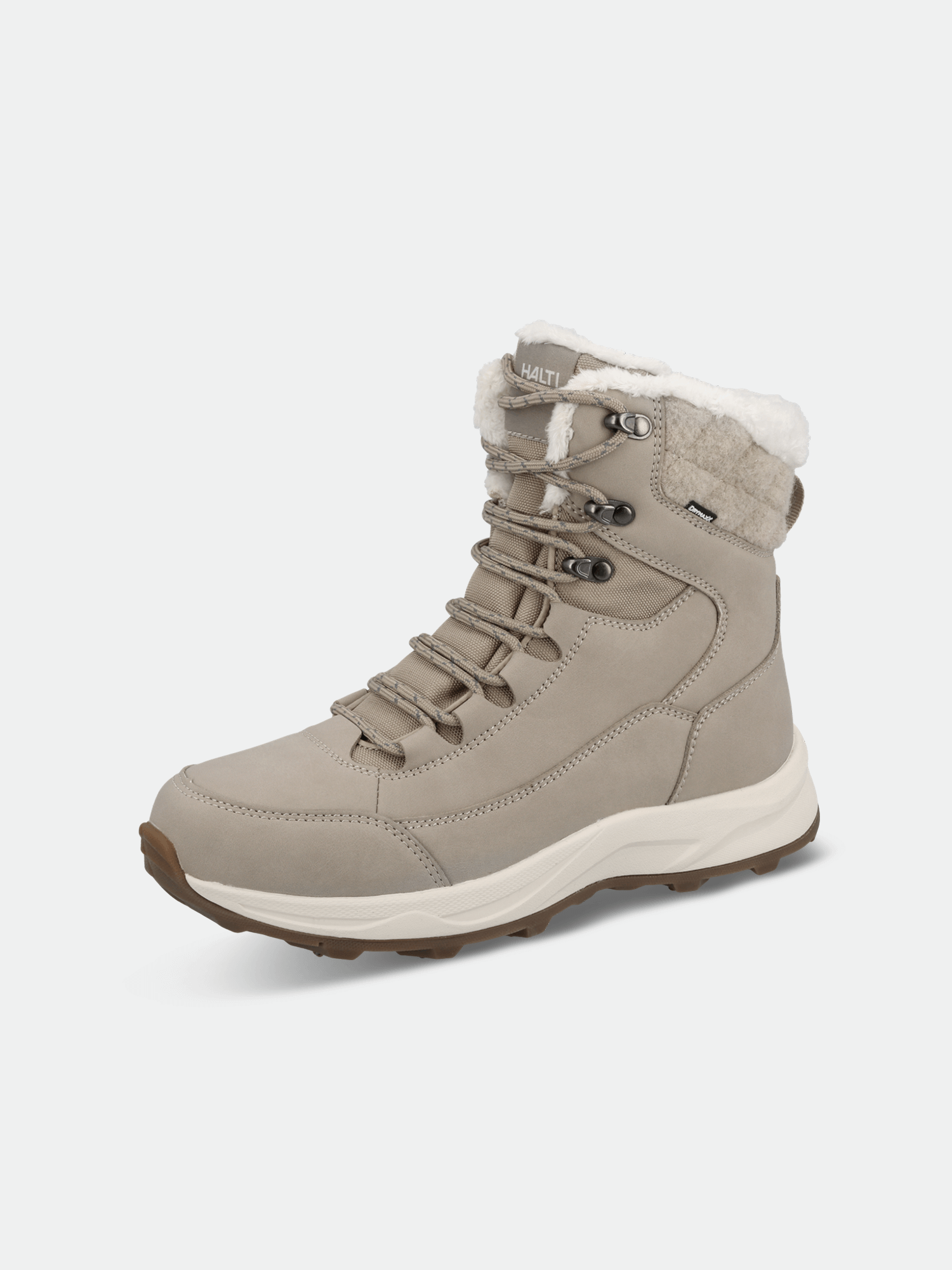 The Halti Duffus DX Spike Shoe Women's is a beige boot with a white GripmaxX Spike sole, lace-up front, and faux fur trim.