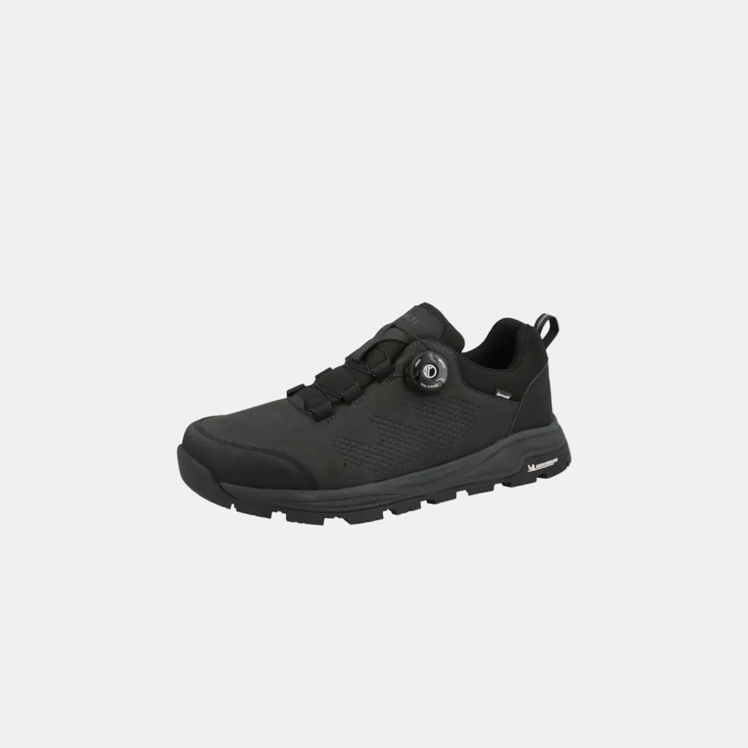 The Halti Buli Low 2 DX FL is a black athletic shoe with a thick Michelin sole and dial closure on a white background.