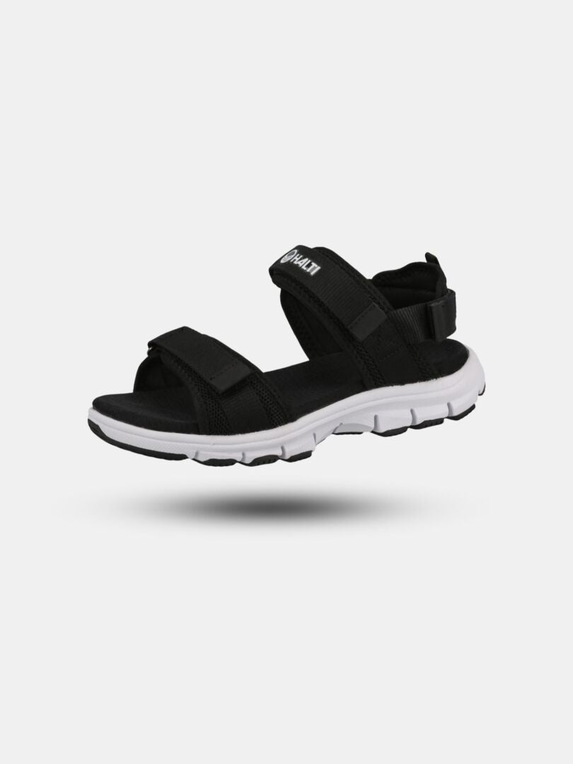 Halti Resa 2 Sandal Womens: black sandal with adjustable straps, white sole, and lightweight phylon midsole.