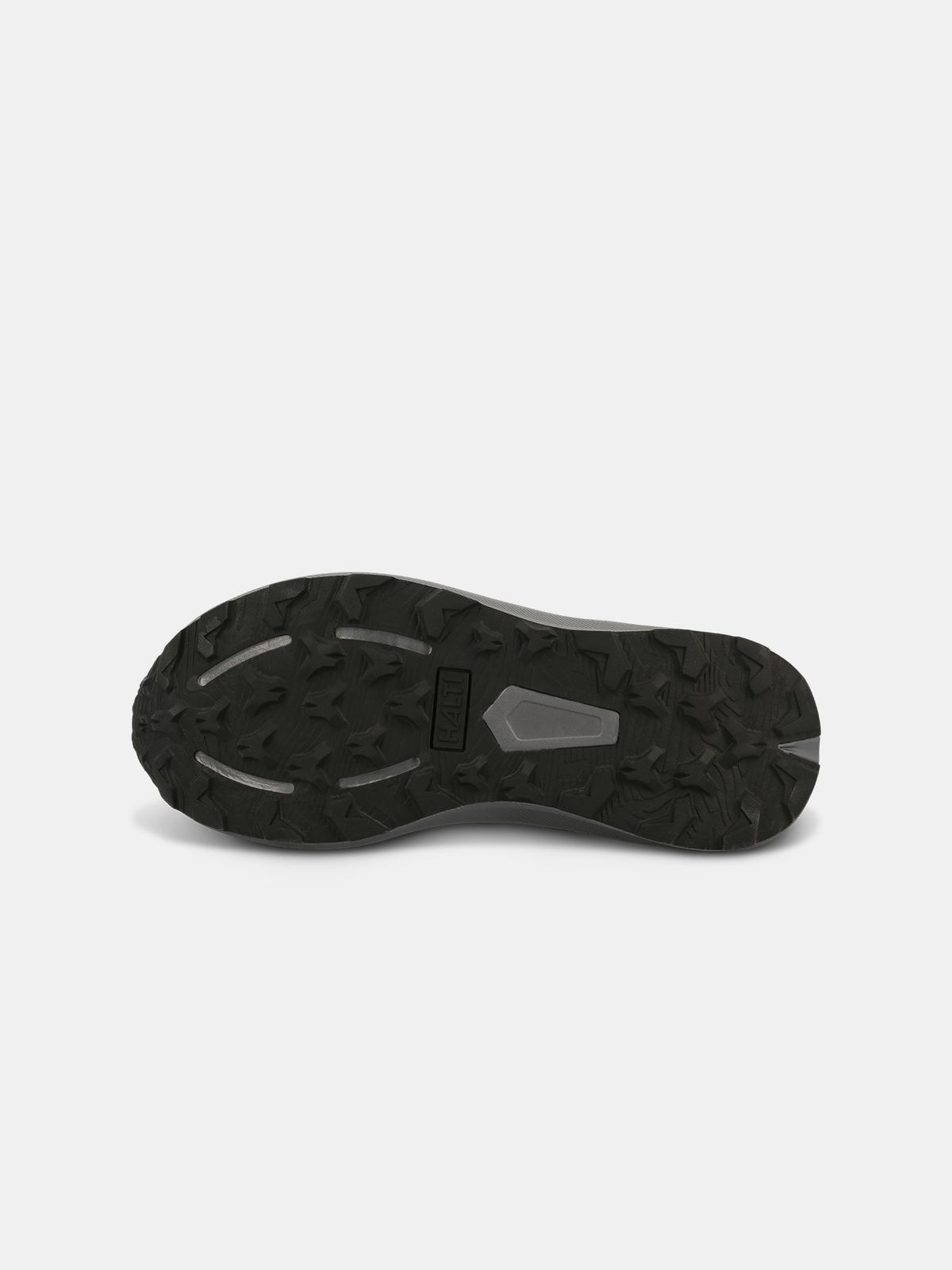 Bottom view of Halti Rapid Mid Freelock DX Shoe Unisex, showing black waterproof sole with rugged tread on white background.