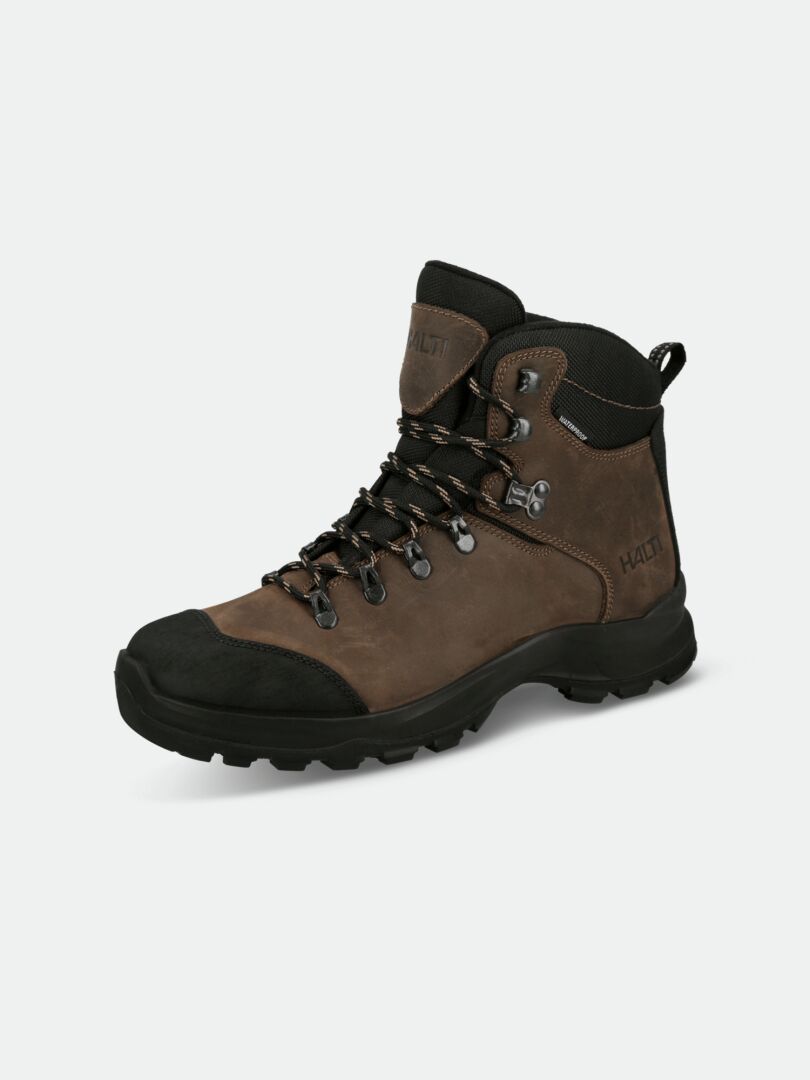 The Halti Gompa 2 DX Hiking Boot features a MICHELIN Trek sole, waterproof brown/black design, and rugged tread.
