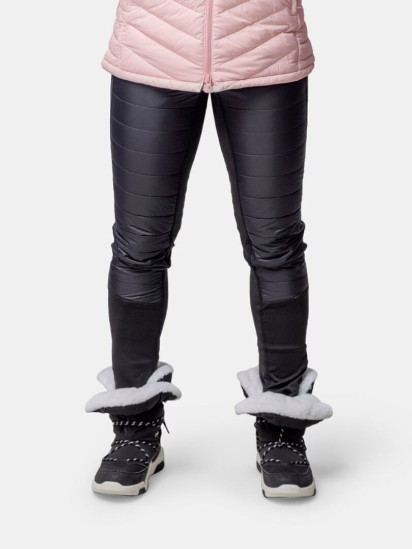 Model wears Halti Jeti DX Winterboot Women's, pink jacket, and black padded pants on a white background.