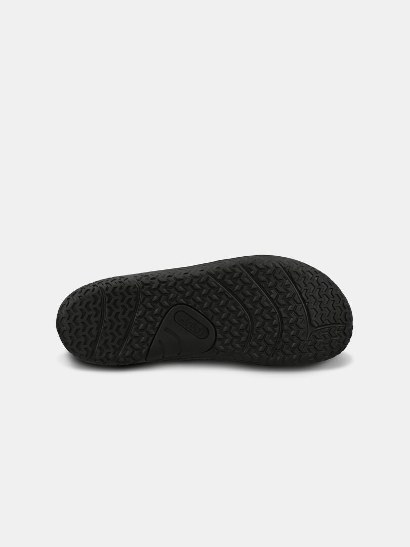 The image shows the black rubber sole of the Halti Tuntuma Barefoot Shoe with textured tread for a natural gait.