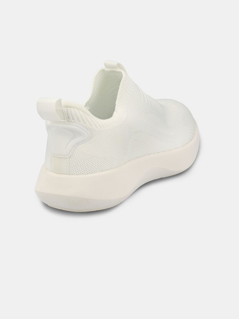 The Halti Snabb 2 StepIn Women's Sneaker is a white, hands-free slip-on shown from the back and side on a plain background.