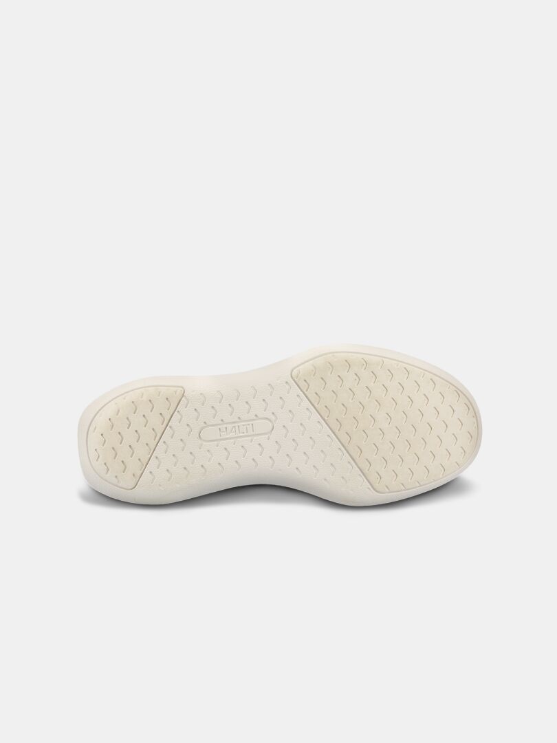 The Snabb 2 StepIn Sneaker Women's by Halti features a lightweight sole with textured grip and HALTI embossed in the center.