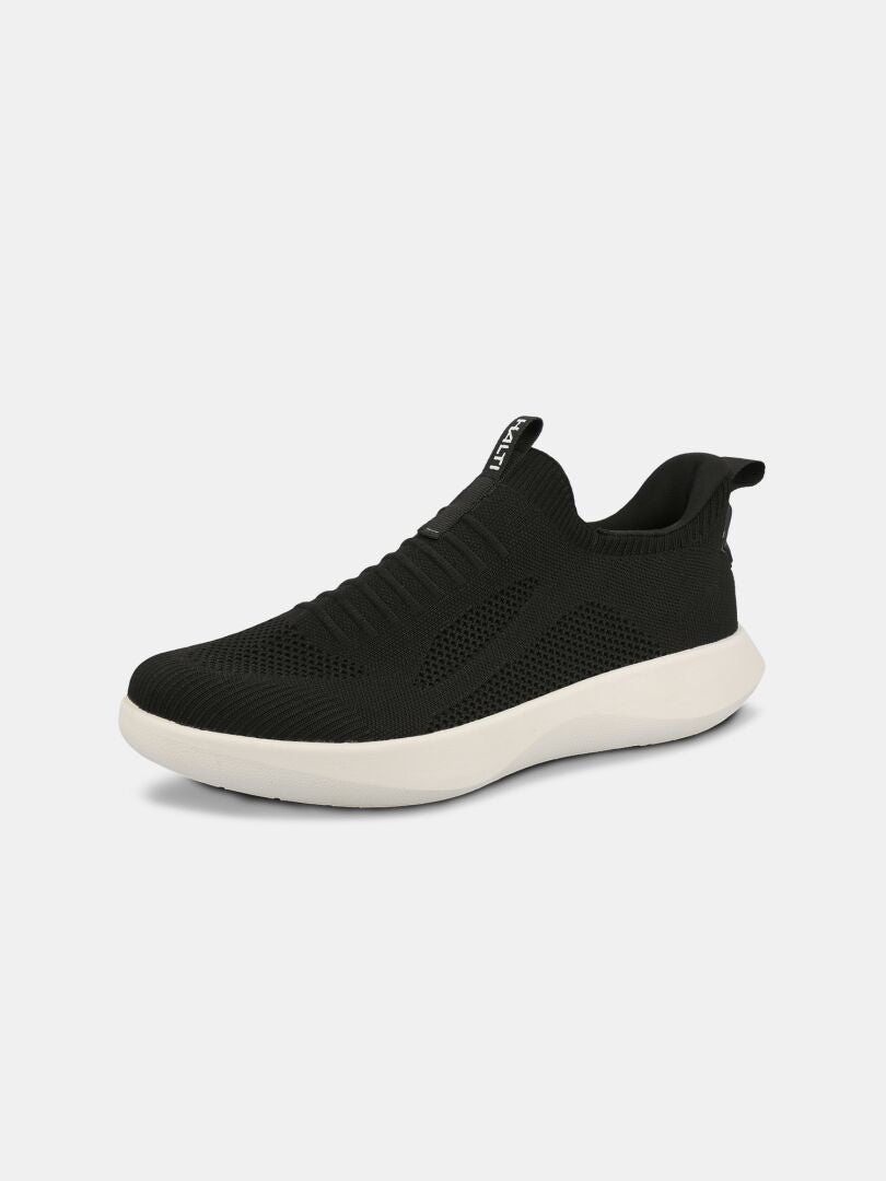 Halti Snabb 2 StepIn Sneaker Women's: black mesh knit, white sole, pull tabs; displayed on plain background.