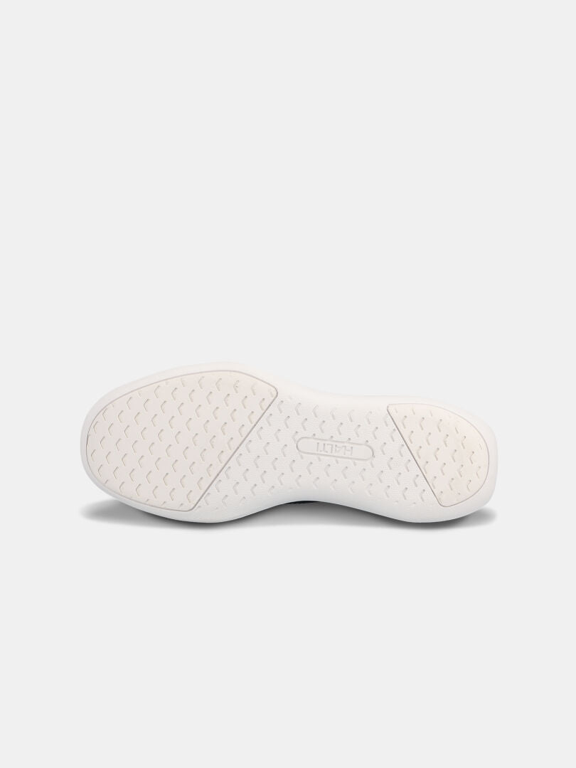 The Snabb 2 StepIn Sneaker Men's by Halti features a lightweight slip-on sole with a textured pattern and Halti branding.
