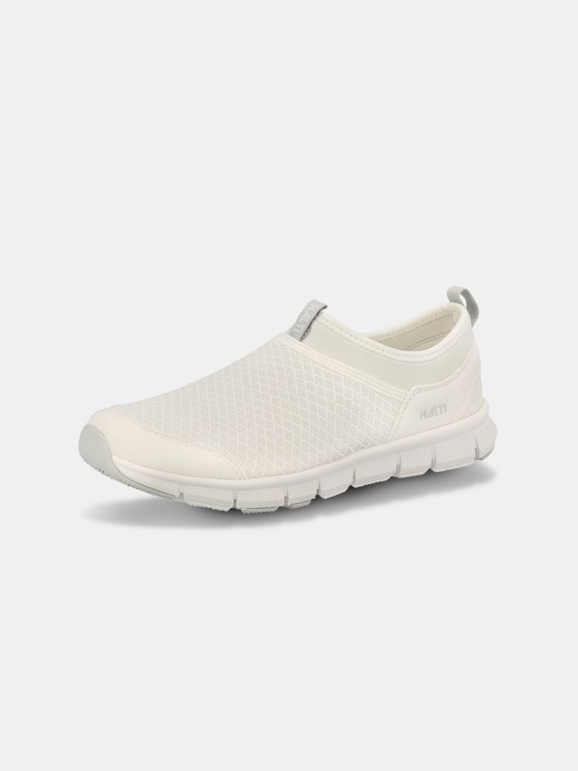 The Halti Lente 3 Women's is a white slip-on with a mesh upper, gray accents, and a thick rubber sole.