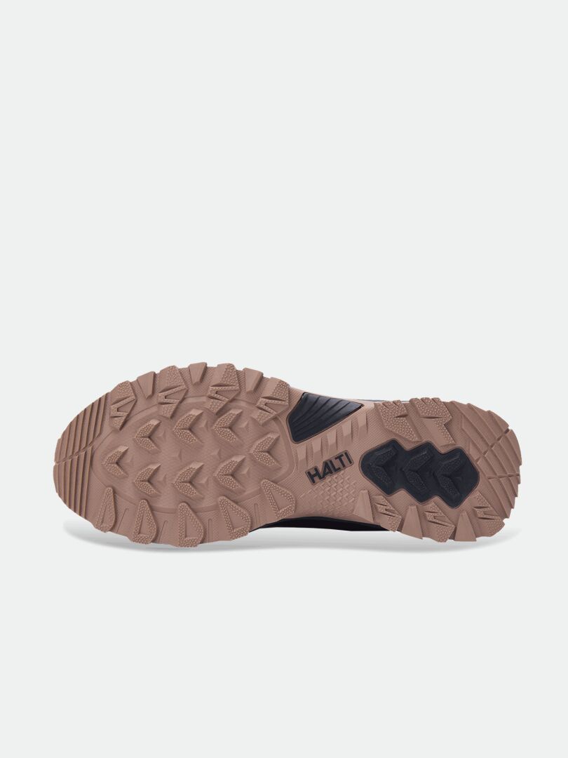 Tan and black lugged outsole of Halti Fara Mid 4 DX Outdoor Shoe Women’s, shown with Halti branding on a light background.