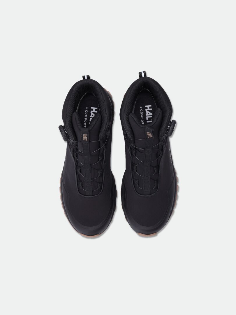Halti Fara Mid 3 DX Freelock outdoor shoes in black with trail rubber outsole, top view on light background.