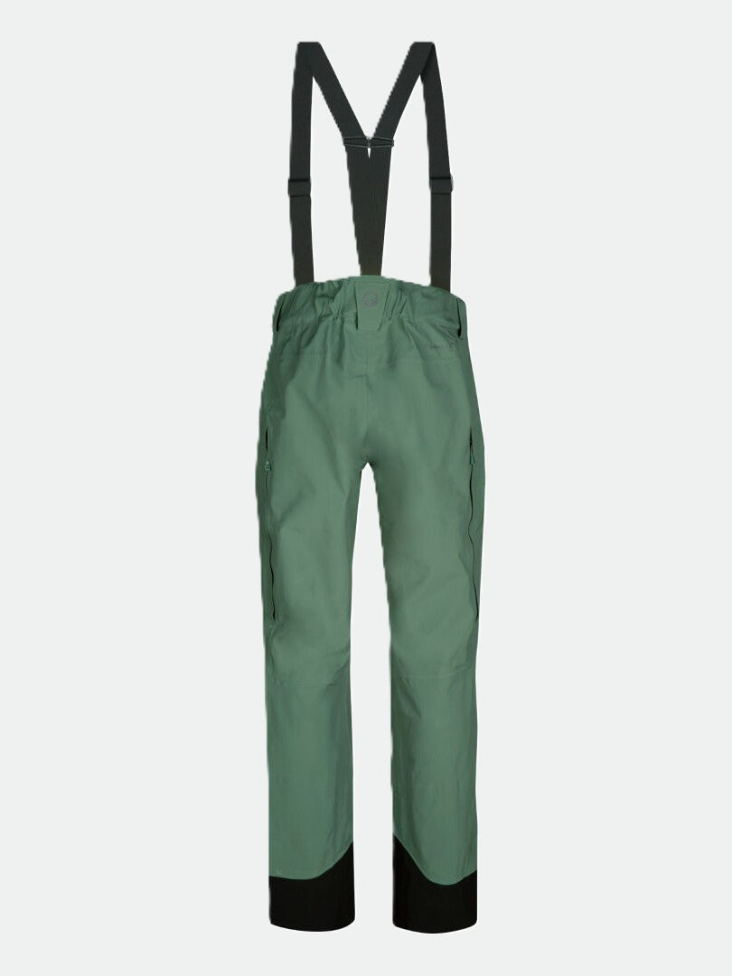 Halti Settler 3L DrymaxX Womens ski pants in green with black ankle patches and suspenders, front view.