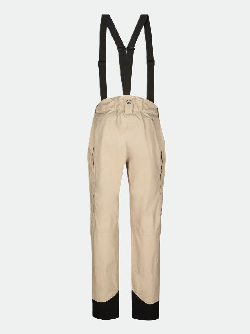 Halti Settler 3L DrymaxX Womens beige waterproof ski pants with black suspenders and ankle accents on plain background.