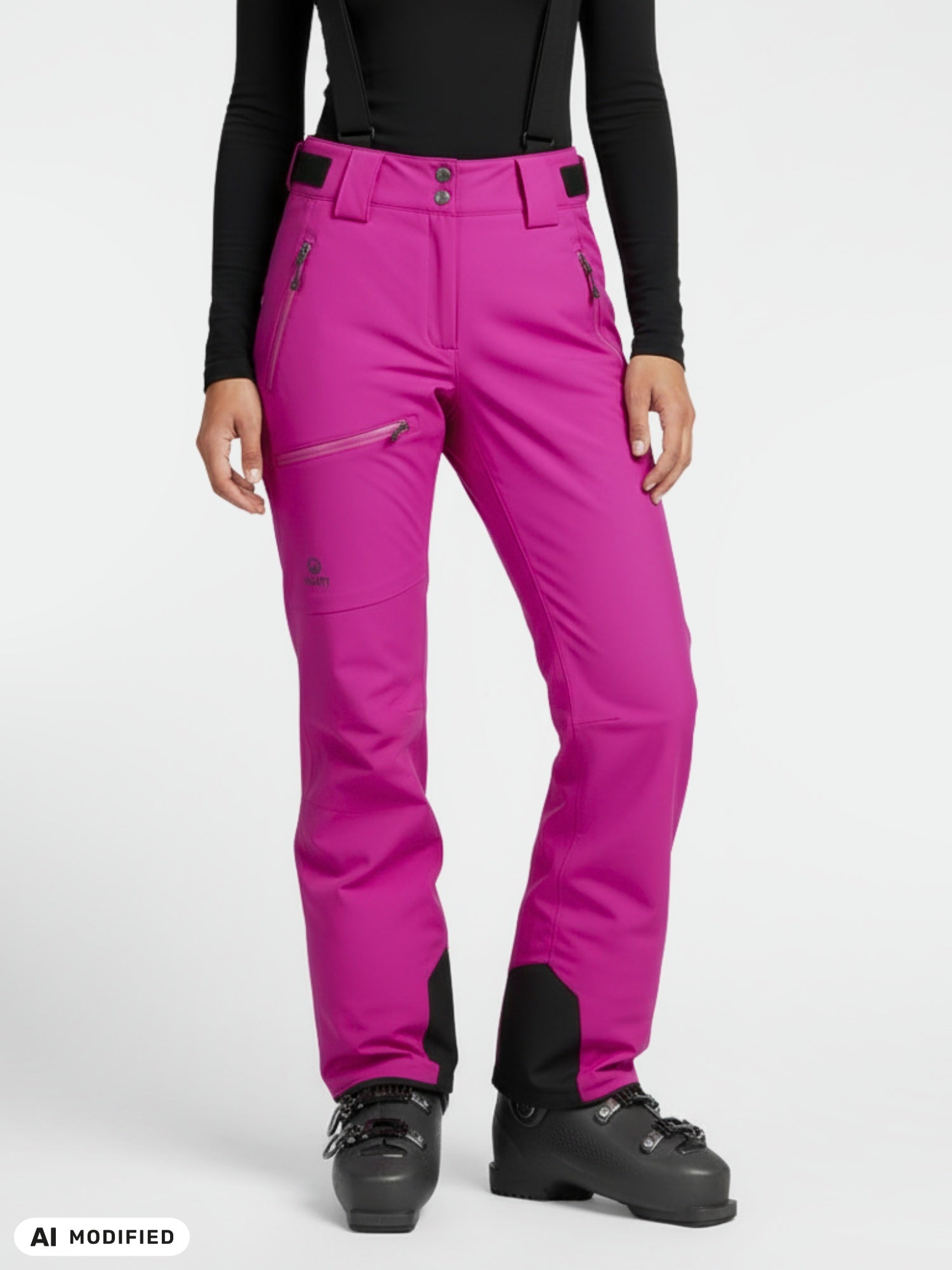 Person in Halti Carvey DX Women's Ski Pants, black ski boots, and long-sleeve black top stands against a white background.