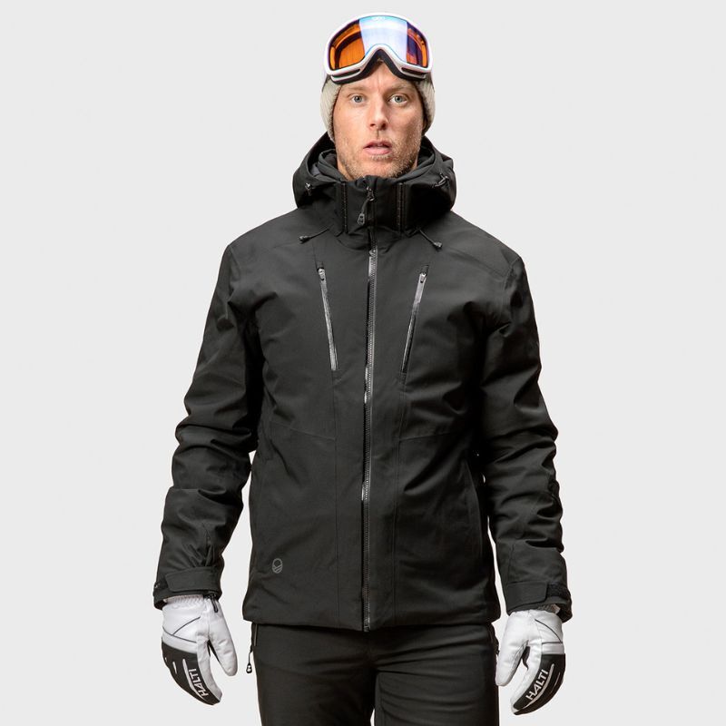 Man wearing a black Halti Vertica DX Ski Jacket, beanie, and goggles on his forehead.
