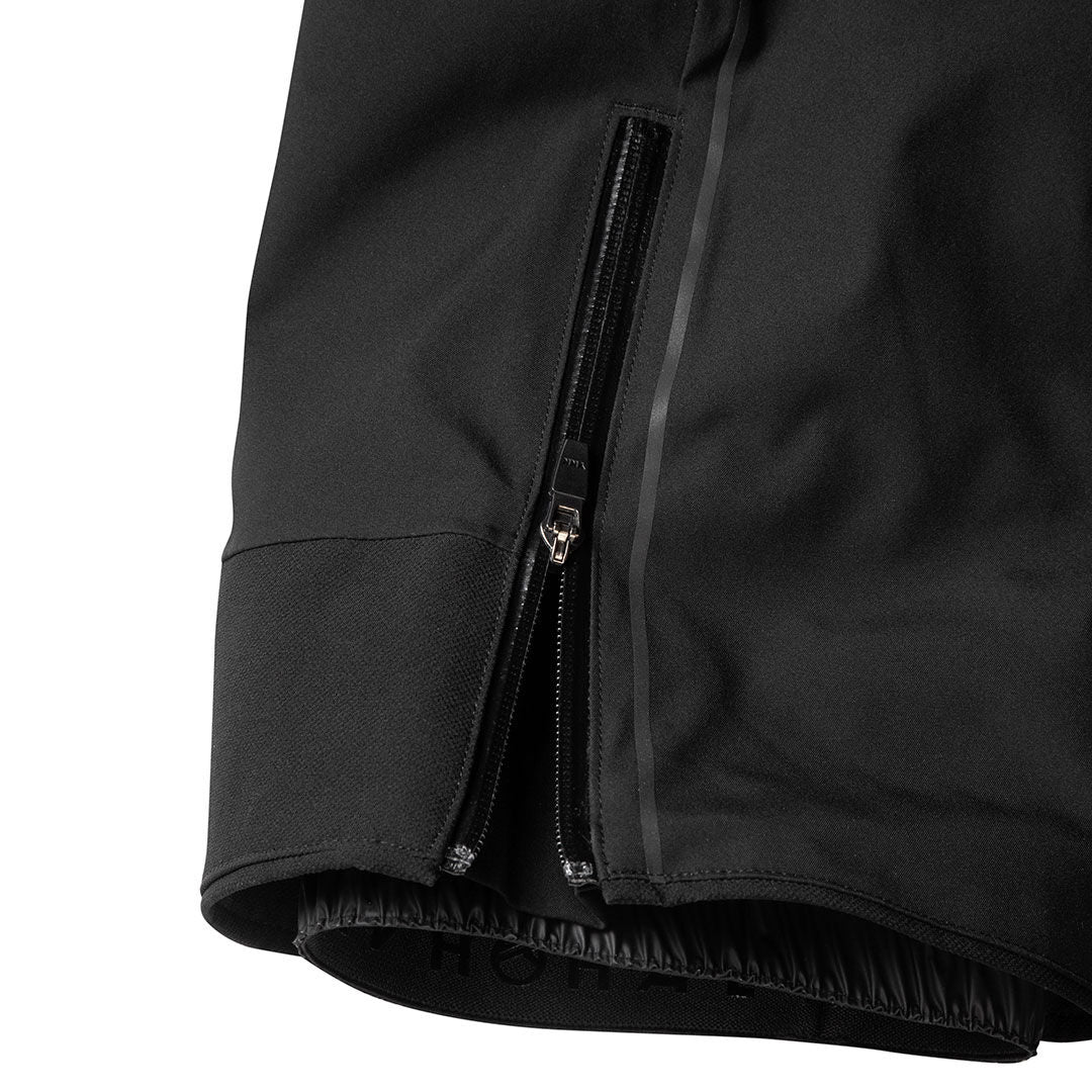 Close-up of Halti Vertica DrymaxX Ski Pants Men’s hem with waterproof vertical zipper and elastic bottom edge.
