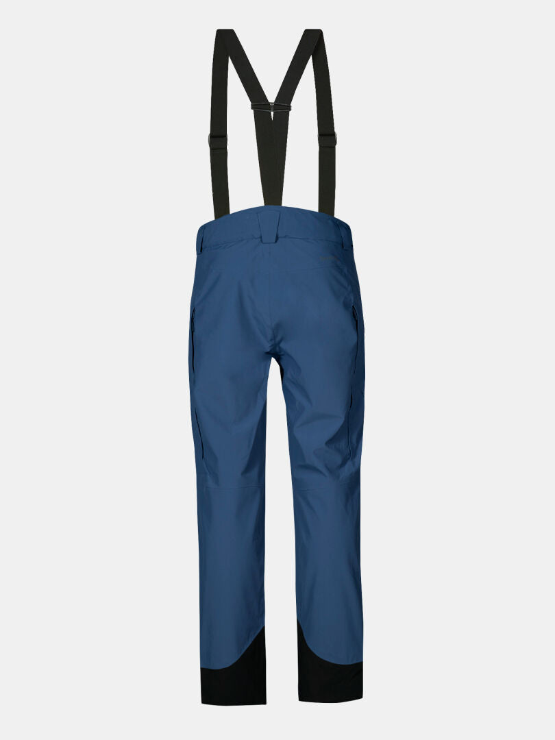 Halti Settler 3L DX men's ski pants in blue, with black suspenders and reinforced cuffs, shown on a light background.