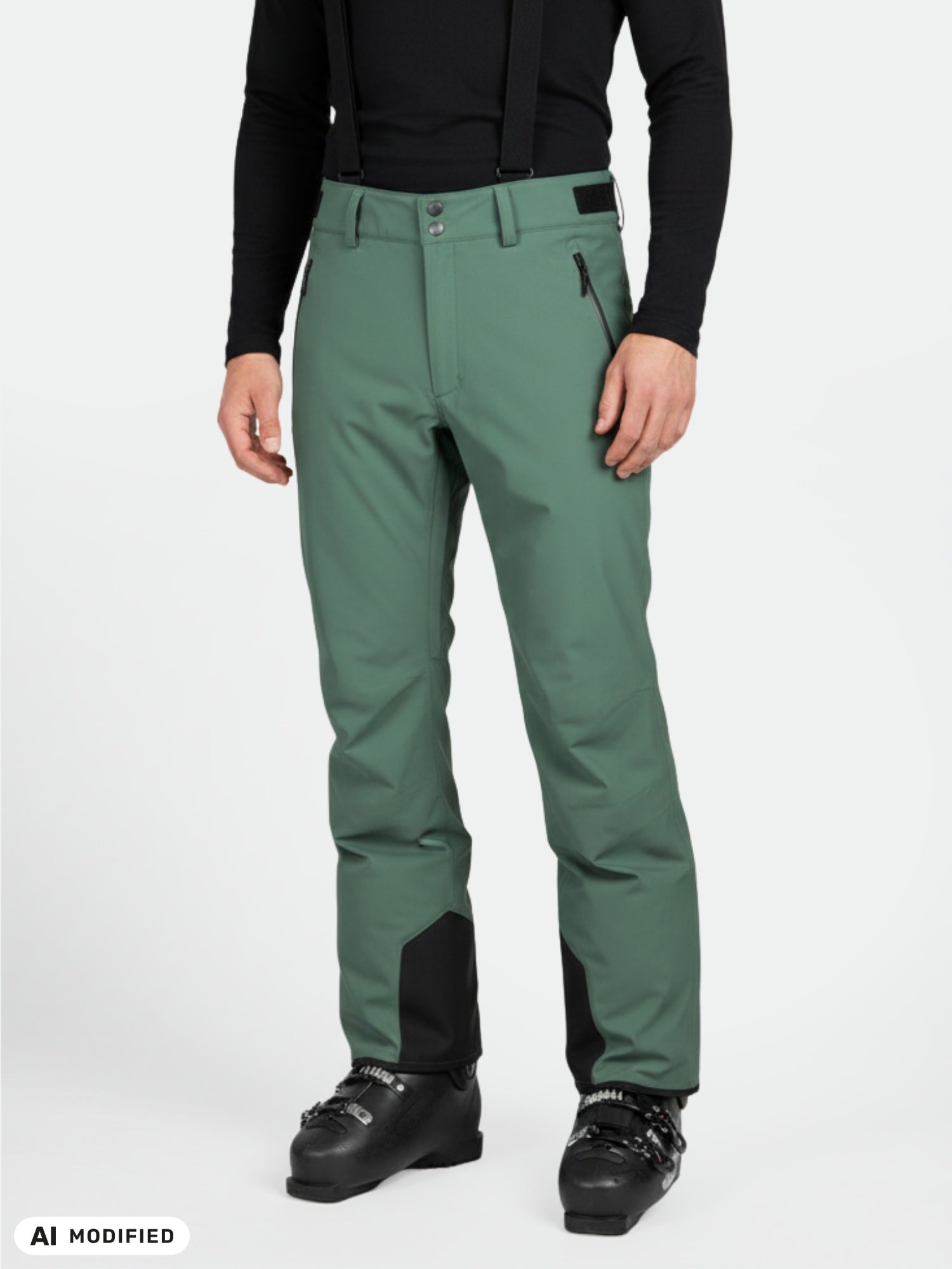Man in Halti Trusty DX Ski Pants (green) with black suspenders, boots, and long-sleeve top, facing forward.