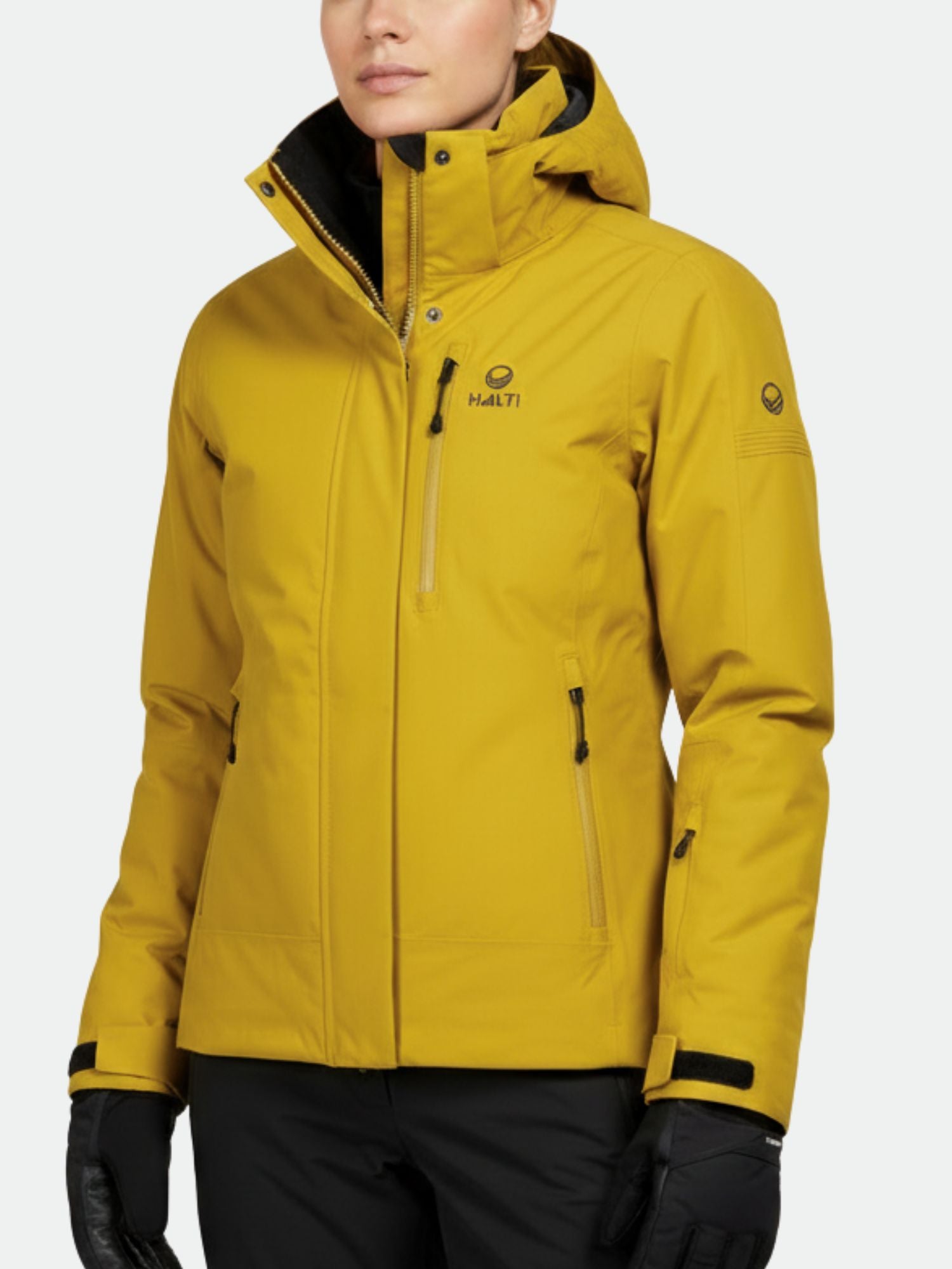 A woman wears the Halti Radius DrymaxX Ski Jacket in yellow with black gloves, shown waist up against a plain background.