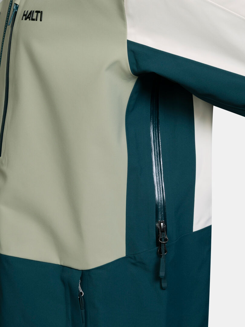 Halti Rizle Unisex 3L DX Ski Jacket in sage green, deep teal, and white with a zippered side pocket.