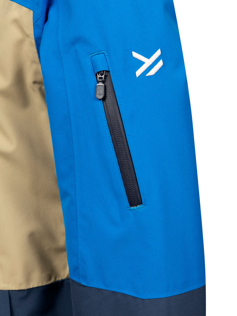 Close-up of Melvik Dx Ski Jacket Men's by Halti: blue sleeve with black zipper pocket and white logo above it.