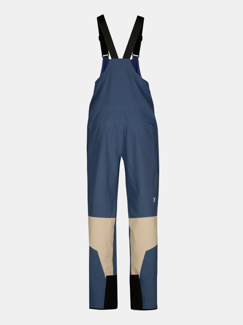 Halti Rizle 3L Dx Ski Pants Unisex in blue and beige with black straps, shown on a plain gray background.