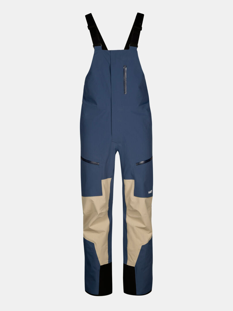 Blue Rizle 3L Dx Ski Pants with tan reinforced knees, black suspenders, and a waterproof, breathable design.