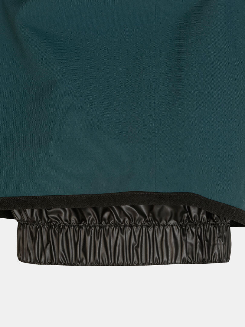 Close-up of the Rizle 3L Dx Ski Pants Unisex leg hem featuring a 3-layer construction and a black elasticized gaiter.