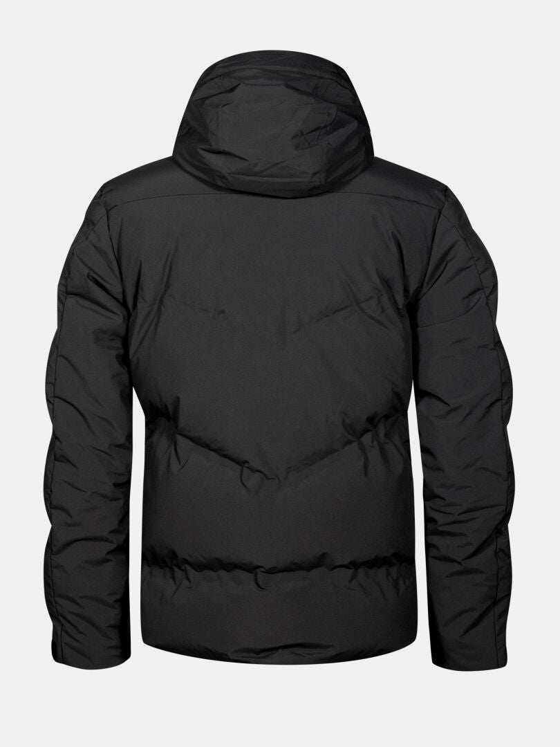 The Halti Nordic Arcty II Men's Ski Jacket in black with a hood is shown from the back on a gray background.