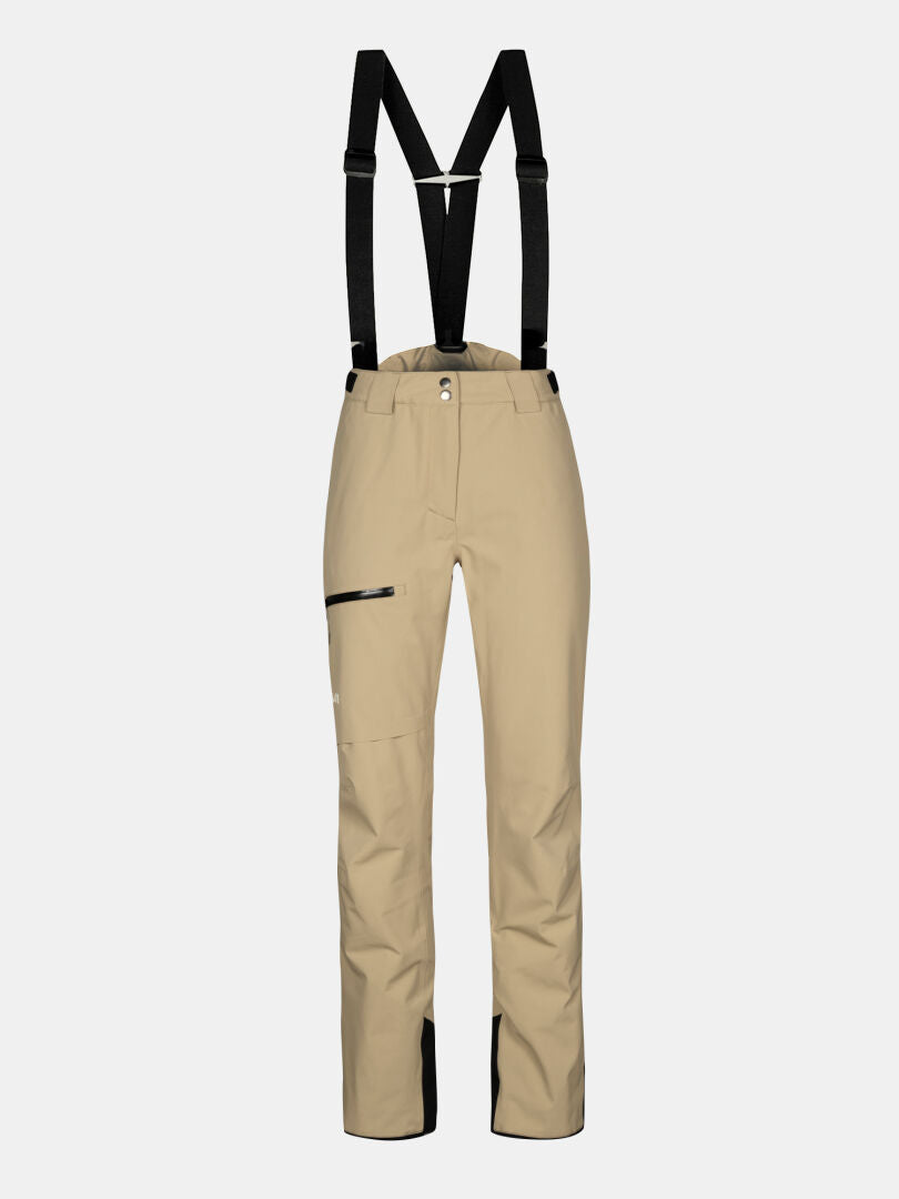 Halti Carvey II DX Women's beige ski pants with black suspenders, zip thigh pocket, and black inner ankle trim.