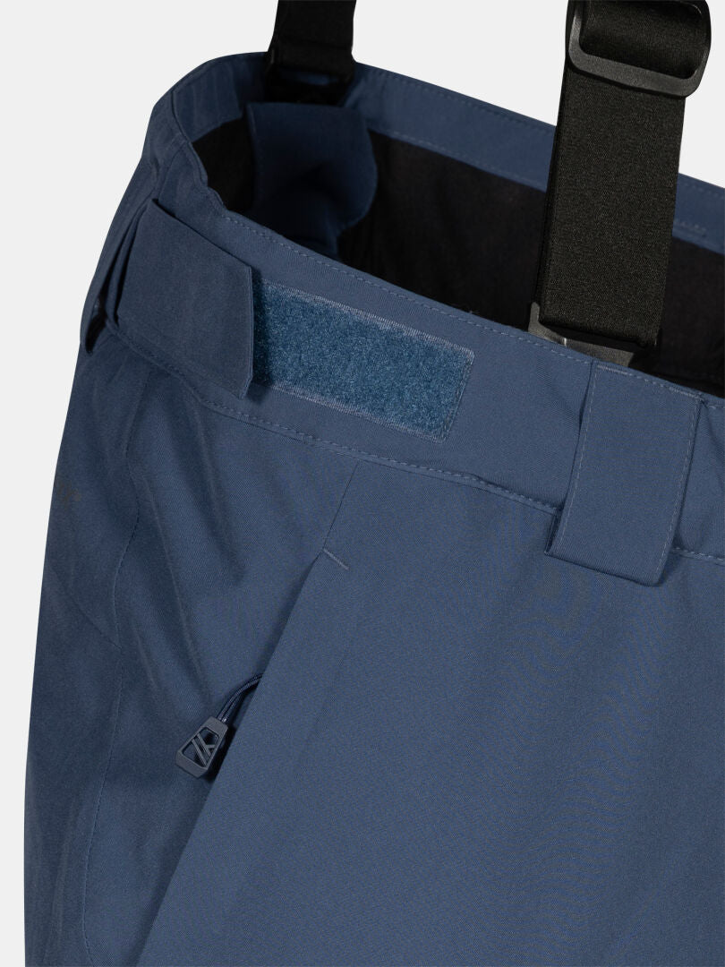 Close-up of Halti Carvey II DX Men’s Ski Pants with black suspenders, Velcro waistband, and zippered pocket.