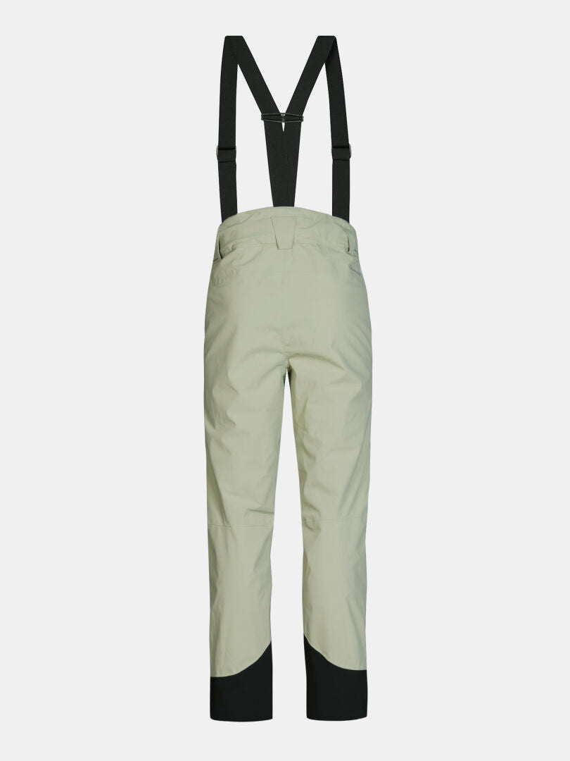 Light green Halti Carvey II DX Ski Pants Men’s with black suspenders and black reinforced cuffs.