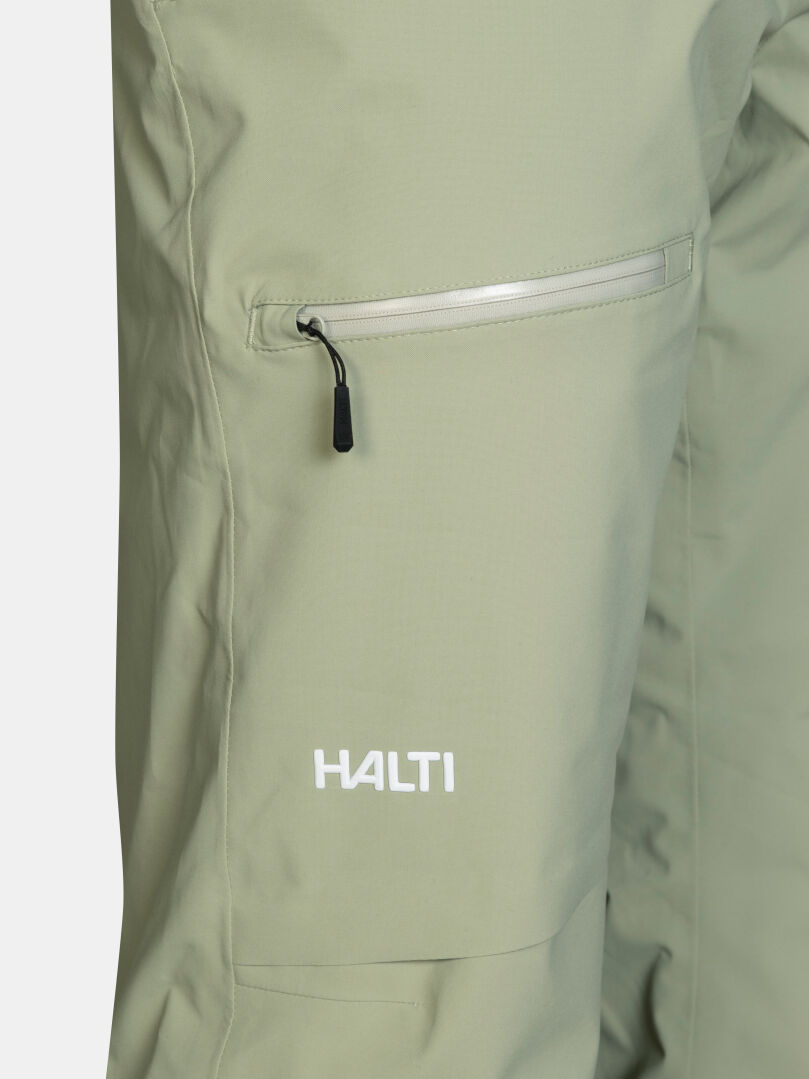 Sage green Halti Carvey II DX Ski Pants with a zippered pocket and a logo printed at the hem.