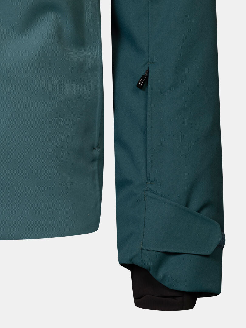 Close-up of a waterproof teal Recier DX Ski Jacket Men’s sleeve with an adjustable cuff and zippered pocket.