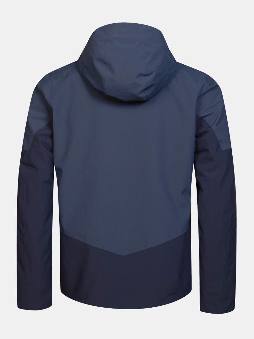 Back view of the Halti Melvik II DX Ski Jacket Men’s, an insulated blue jacket with dark blue sleeves and lower back panels.