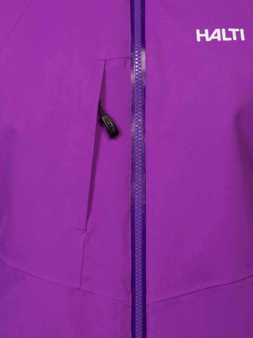 Close-up of a waterproof purple Halti Recier DX Ski Jacket Women’s with a zippered chest pocket and white brand name.
