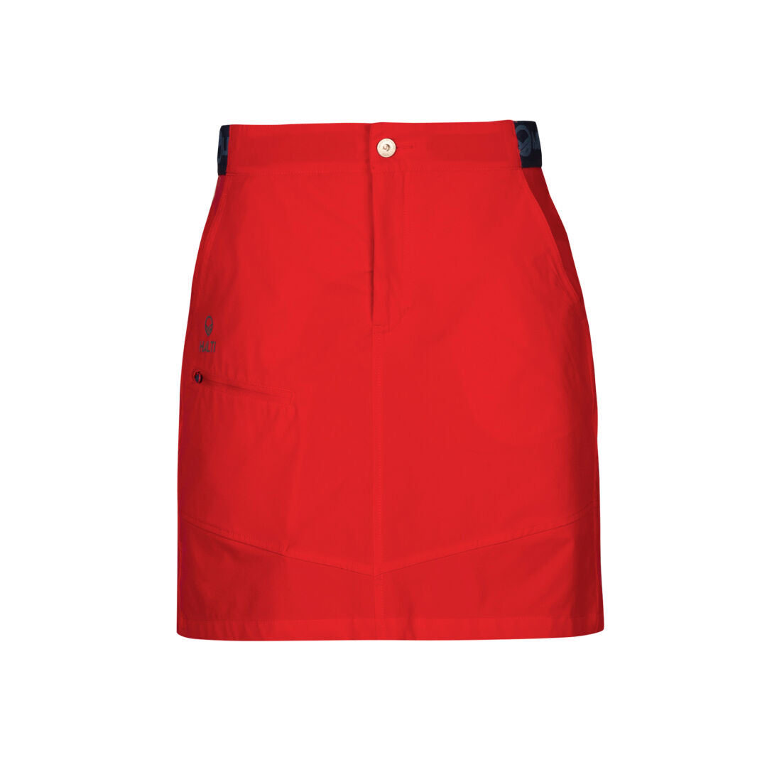 Halti Pallas Womens Lite X-stretch Skort in red with front button, zipper, left pocket, and black waistband accents.