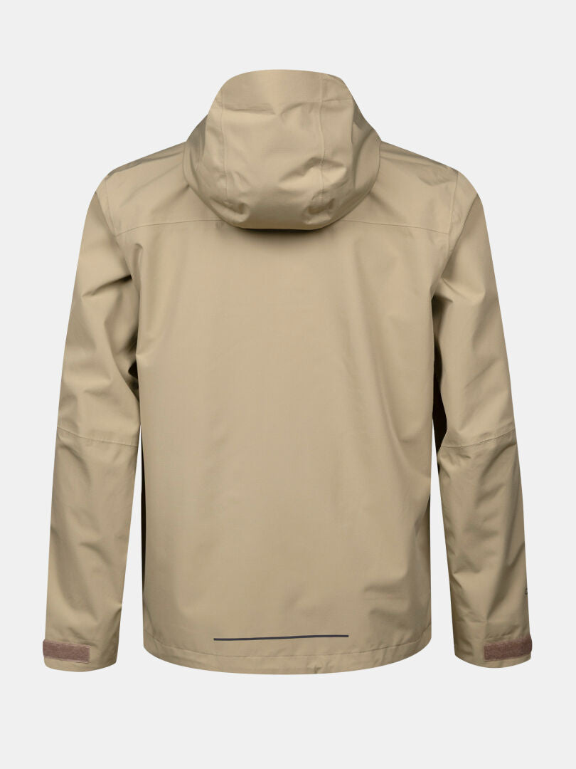 The Halti Forter DX Shell Jacket Men's in tan, with long sleeves and straight hem—ideal for hiking and outdoor use.