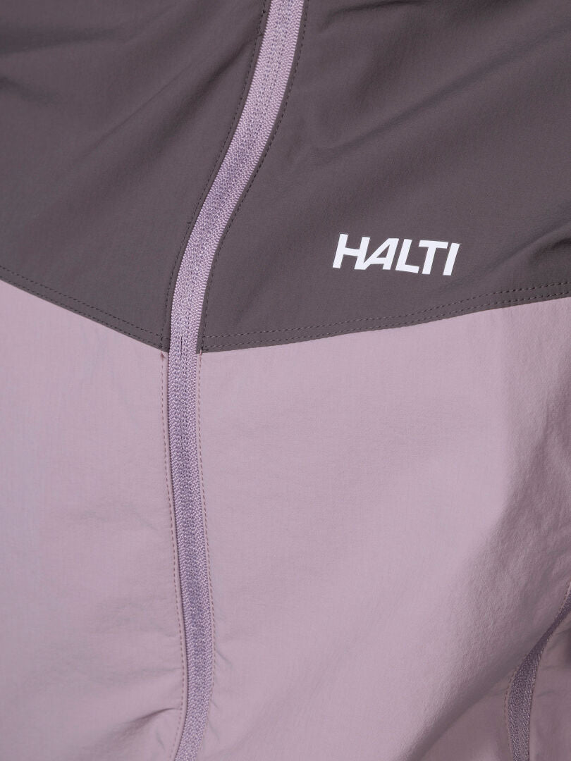 Close-up of Halti Pallas Evo X-stretch Jacket Women's in light purple and gray with logo on the chest.