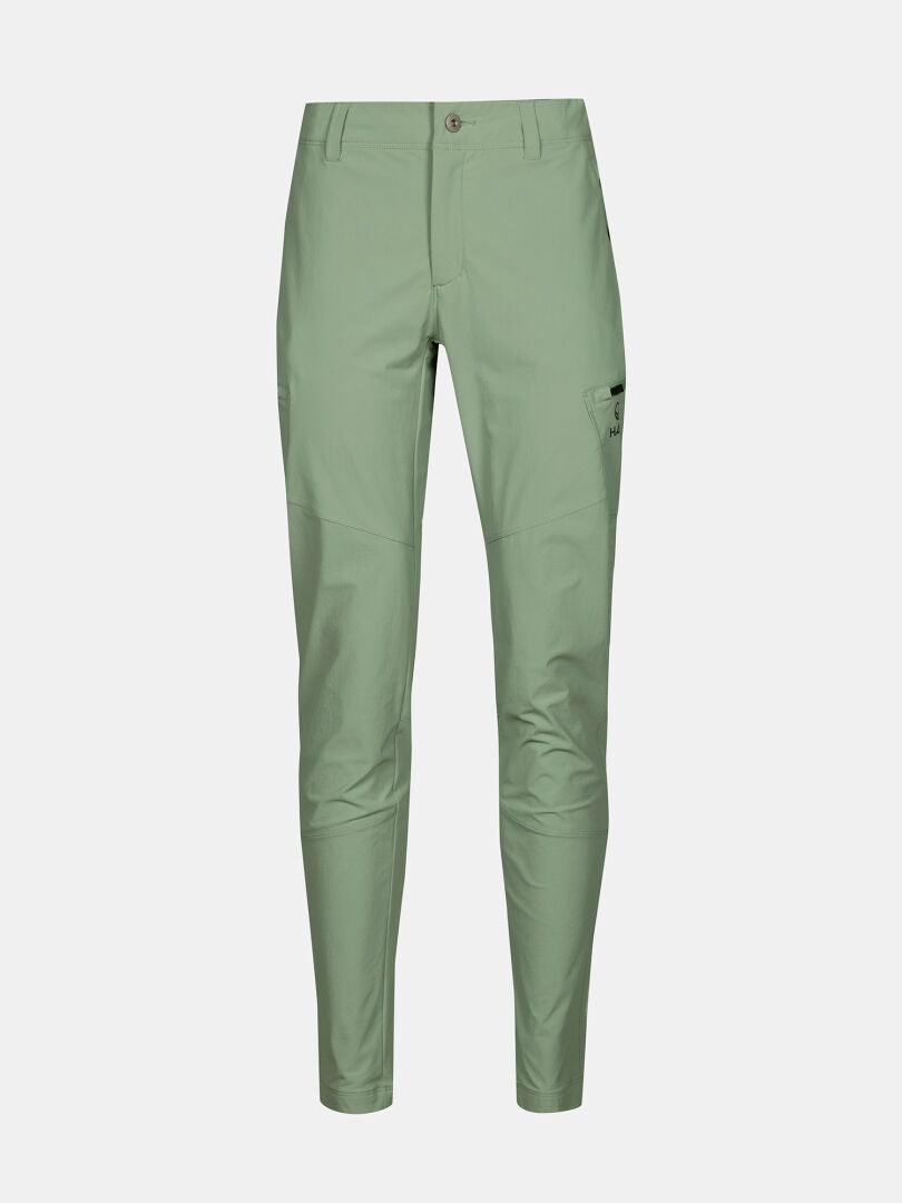 Halti Pallas Evo X-stretch Womens Pants: light green, slim-fit, breathable, side pockets, small right thigh logo.