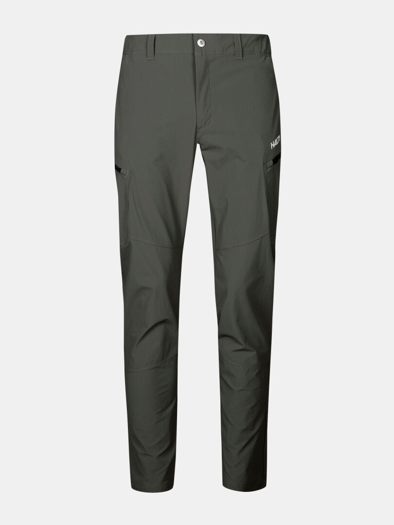 Halti Pallas Evo X-stretch men's green hiking pants with side pockets and white logo, shown on white background.