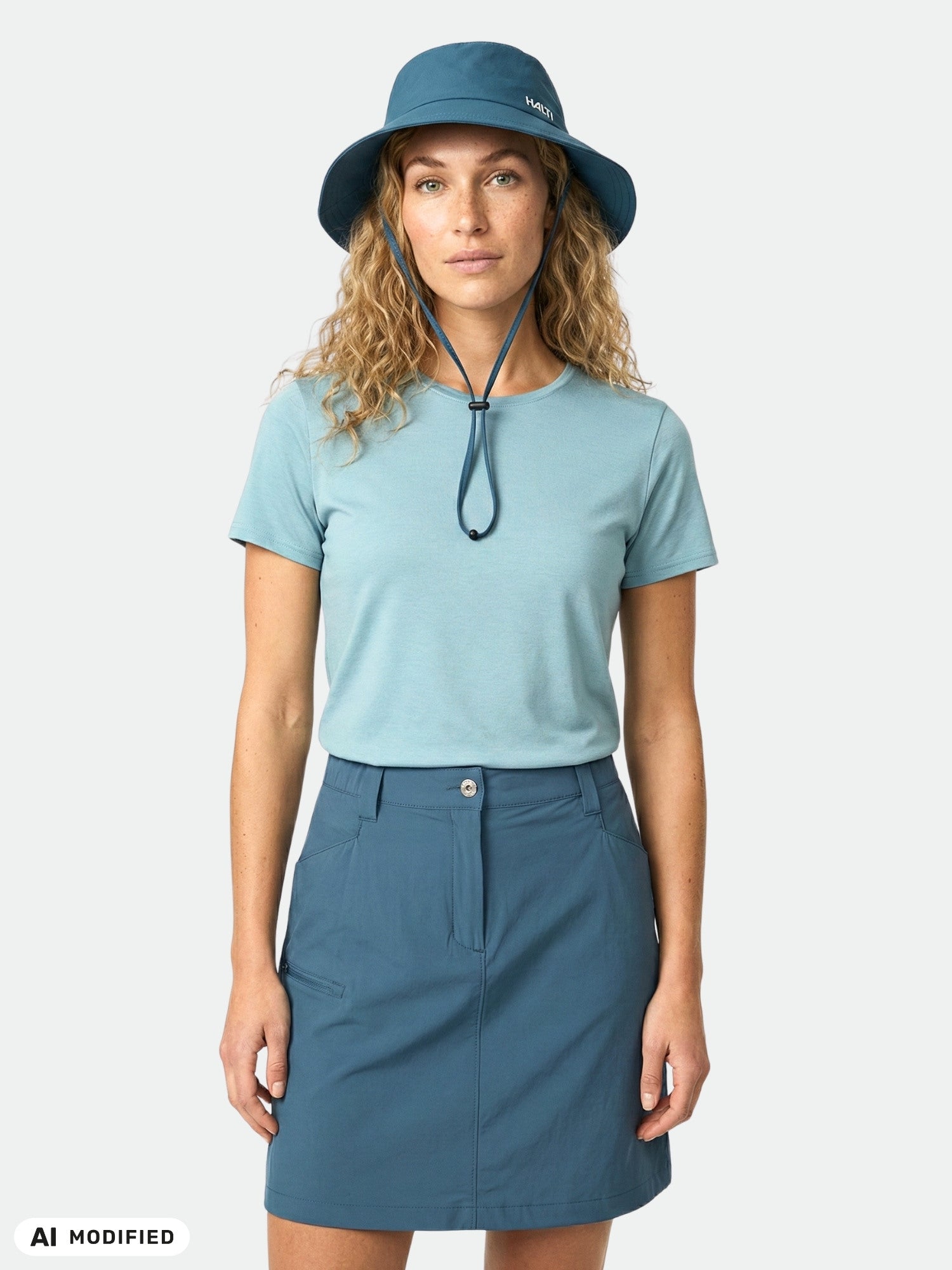 Woman in a Halti Tuntu II Merino T-shirt stands facing forward against a plain white background.