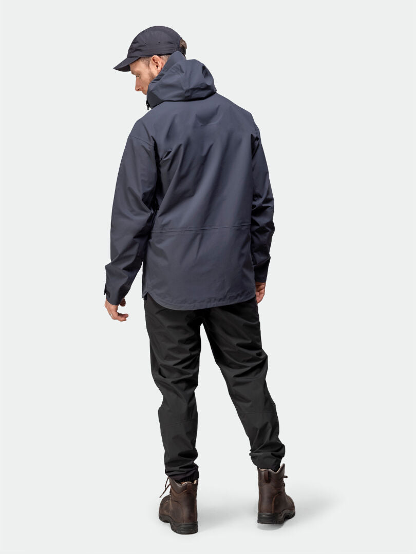 Man wearing Halti Kajana 3L DX Shell Jacket, seen from behind—perfect choice for outdoor enthusiasts.