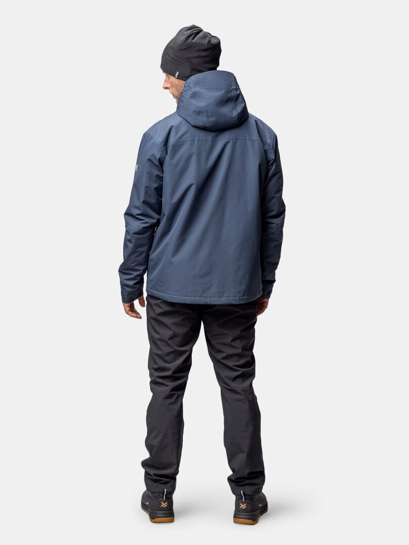 A person in a Halti Forter DX Warm Shell Jacket stands with their back to the camera.