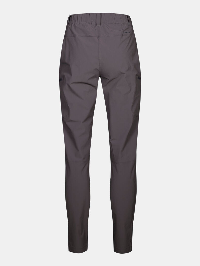 Back view of Halti Pallas Evo Plus X-stretch Women's Outdoor Pants in dark gray with elastic waistband on white background.